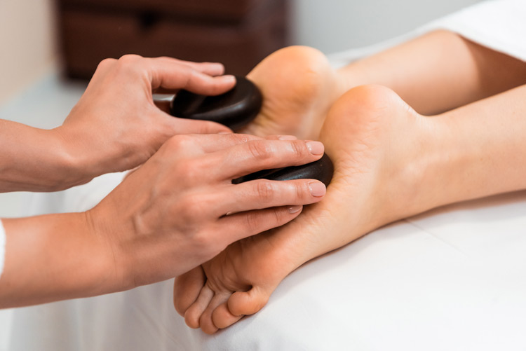 hot stone massage used on the feet