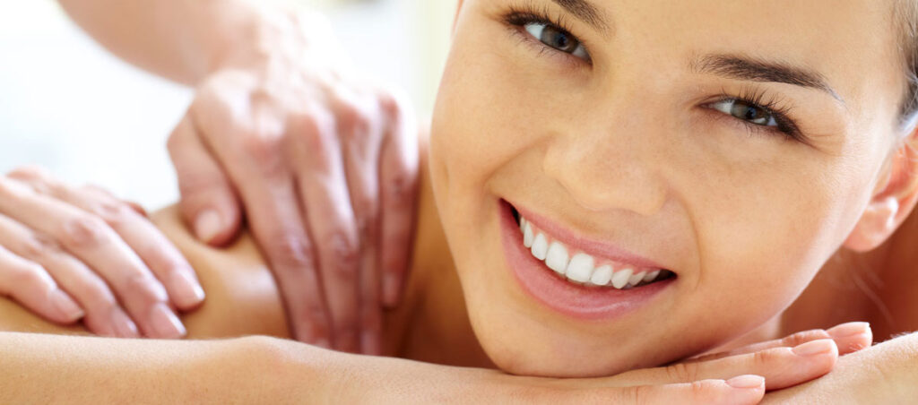 Smiling woman at Got Knots for a Therapeutic massage therapy treatment