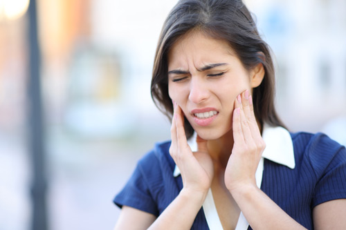 woman suffering TMJ Pain